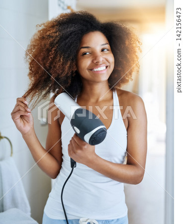 Girl, beauty and hair dryer for blowing in bathroom, heat treatment and electric appliance. Female person, cosmetics and tool for self care or curly hairstyle, grooming and confidence in dermatology Girl, beauty and hair dryer for blowing in bathroom, heat treatment and electric appliance. Female person, cosmetics and tool for self care or curly hairstyle, grooming and confidence in dermatology 142156473