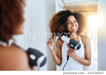 Girl, smile and blow dryer for hair care in bathroom, heat treatment and electric appliance. Female person, cosmetics and tool for beauty or curly hairstyle, grooming and confidence in dermatology Girl, smile and blow dryer for hair care in bathroom, heat treatment and electric appliance. Female person, cosmetics and tool for beauty or curly hairstyle, grooming and confidence in dermatology 142156507