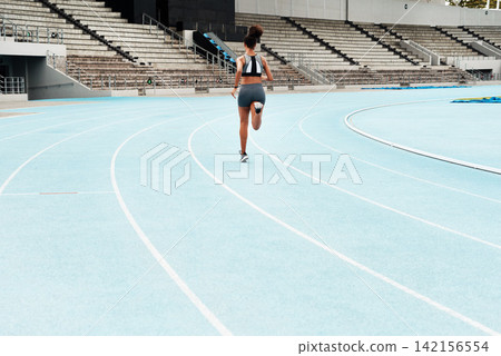 Woman, back or athlete running on track for exercise, cardio training or outdoor workout to practice. Speed, go or fast girl runner in sports race, performance or athletics for wellness on stadium Woman, back or athlete running on track for exercise, cardio training or outdoor workout to practice. Speed, go or fast girl runner in sports race, performance or athletics for wellness on stadium 142156554