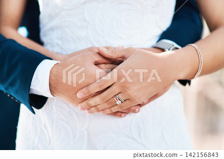 Couple, hug and wedding ring in outdoors, love and symbol for promise of loyalty or commitment. People, hands and embrace or icon for partnership, support and trust in marriage or relationship Couple, hug and wedding ring in outdoors, love and symbol for promise of loyalty or commitment. People, hands and embrace or icon for partnership, support and trust in marriage or relationship 142156843
