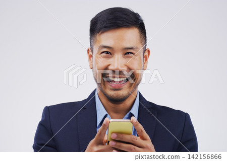 Portrait, businessman and happy with phone in studio for, social media, networking and smile. Asian male person, technology and excited for message, blog and online for connection by white background Portrait, businessman and happy with phone in studio for, social media, networking and smile. Asian male person, technology and excited for message, blog and online for connection by white background 142156866