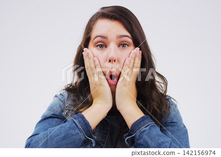 Woman, portrait and shocked on studio background for wow with crazy expression, social media and hands. Female person, surprise and grey backdrop with omg emoji face for gossip, secret drama and wtf Woman, portrait and shocked on studio background for wow with crazy expression, social media and hands. Female person, surprise and grey backdrop with omg emoji face for gossip, secret drama and wtf 142156974