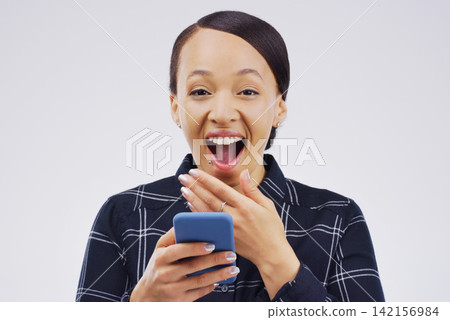 Woman, portrait and phone surprise for news in studio, victory notification and lottery success. Female person, shock and excited for bonus on gray background, promotion email and discount deal Woman, portrait and phone surprise for news in studio, victory notification and lottery success. Female person, shock and excited for bonus on gray background, promotion email and discount deal 142156984