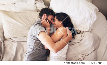 Happy, bed and couple hug at morning with embrace at home with love, marriage and cuddle together. Smile, above and blanket fort in a bedroom in a house with care and romance with cotton duvet Happy, bed and couple hug at morning with embrace at home with love, marriage and cuddle together. Smile, above and blanket fort in a bedroom in a house with care and romance with cotton duvet 142157046