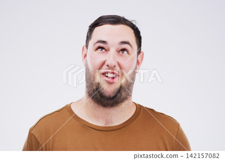 Man, funny face and open mouth in studio for comic, comedy and crazy or weird expression. Comedian, facial gesture and pout for joke, prank and laugh on isolated gray background with mockup space Man, funny face and open mouth in studio for comic, comedy and crazy or weird expression. Comedian, facial gesture and pout for joke, prank and laugh on isolated gray background with mockup space 142157082