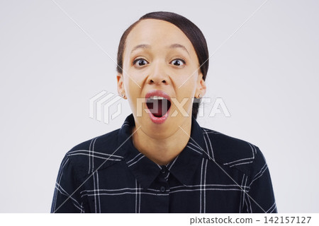 Woman, surprised and portrait in studio for good news, gossip and secret on white background. Shocked, comic and Puerto rico female person with funny face for wow, omg and reaction to meme or story Woman, surprised and portrait in studio for good news, gossip and secret on white background. Shocked, comic and Puerto rico female person with funny face for wow, omg and reaction to meme or story 142157127