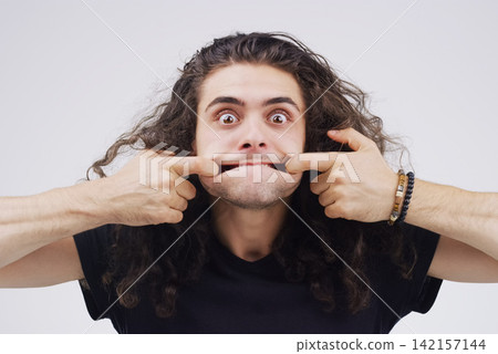 Man, portrait and crazy face in studio for emoji, comedy and comedy by white background. Male person, comedian and emotions for joke, prank and comic for humour, comedy and laugh on backdrop Man, portrait and crazy face in studio for emoji, comedy and comedy by white background. Male person, comedian and emotions for joke, prank and comic for humour, comedy and laugh on backdrop 142157144