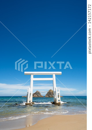 Meoto Iwa, white torii gate standing in the sea with sacred rocks in Itoshima, Fukuoka, Japan Meoto Iwa, white torii gate standing in the sea with sacred rocks in Itoshima, Fukuoka, Japan 142157172