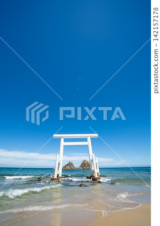 Meoto Iwa, white torii gate standing in the sea with sacred rocks in Itoshima, Fukuoka, Japan Meoto Iwa, white torii gate standing in the sea with sacred rocks in Itoshima, Fukuoka, Japan 142157178