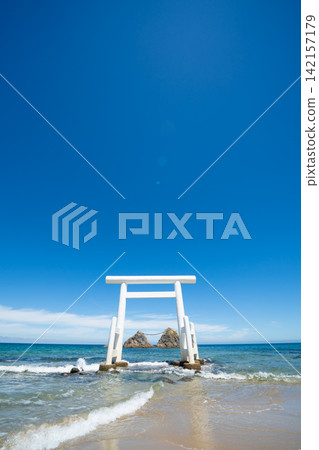 Meoto Iwa, white torii gate standing in the sea with sacred rocks in Itoshima, Fukuoka, Japan Meoto Iwa, white torii gate standing in the sea with sacred rocks in Itoshima, Fukuoka, Japan 142157179