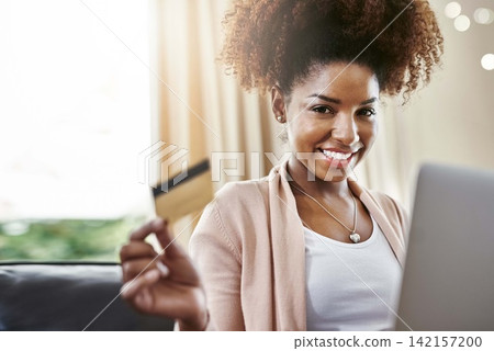 Credit card, laptop and portrait of black woman on sofa in home for online shopping, internet purchase and payment. Ecommerce, fintech and person on computer for website, sales and digital banking Credit card, laptop and portrait of black woman on sofa in home for online shopping, internet purchase and payment. Ecommerce, fintech and person on computer for website, sales and digital banking 142157200