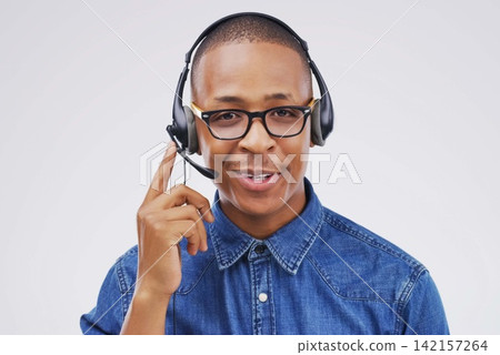 African man, portrait and studio with headphones for customer service or call center, smile for communication. Male person, white background and microphone with happiness for chat or telemarketing African man, portrait and studio with headphones for customer service or call center, smile for communication. Male person, white background and microphone with happiness for chat or telemarketing 142157264