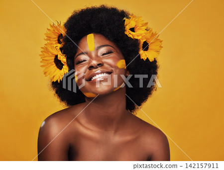 Black woman, sunflower and paint in studio with makeup for beauty with creative, confidence and spring. Cosmetics, yellow background and self love with natural for floral face with smile for skincare Black woman, sunflower and paint in studio with makeup for beauty with creative, confidence and spring. Cosmetics, yellow background and self love with natural for floral face with smile for skincare 142157911