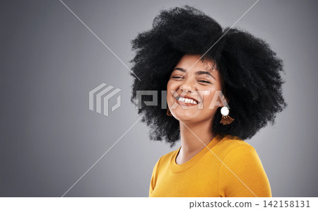 African, beauty and woman with natural hair care in studio, background and mock up with happiness. Cosmetics, treatment and girl with makeup, skincare or pride in healthy afro texture or style African, beauty and woman with natural hair care in studio, background and mock up with happiness. Cosmetics, treatment and girl with makeup, skincare or pride in healthy afro texture or style 142158131