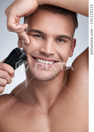 Portrait, man and studio with electric razor, skincare and hygiene for facial grooming. Cosmetic, hair removal and happy for dermatology or wellness, maintenance and shaving tool on background Portrait, man and studio with electric razor, skincare and hygiene for facial grooming. Cosmetic, hair removal and happy for dermatology or wellness, maintenance and shaving tool on background 142158133