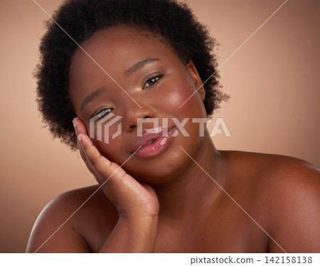 Happy, portrait and black woman in studio for beauty or skincare with make up, cosmetics and wellness. Person, isolated and beige background with lip balm for glow or self care, aesthetic and shine. Happy, portrait and black woman in studio for beauty or skincare with make up, cosmetics and wellness. Person, isolated and beige background with lip balm for glow or self care, aesthetic and shine. 142158138