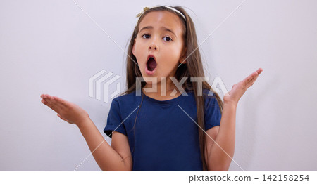 Shock, portrait and girl with surprise and why hand sign with youth and wow from news in studio. Cute, casual fashion and shrug emoji gesture and child with omg and confused with white background Shock, portrait and girl with surprise and why hand sign with youth and wow from news in studio. Cute, casual fashion and shrug emoji gesture and child with omg and confused with white background 142158254