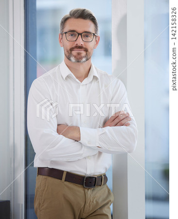 Business man, arms crossed and portrait in the morning with job, smile and confidence at creative company. Manager, office and creative director at a journalism agency with a mature leader and proud Business man, arms crossed and portrait in the morning with job, smile and confidence at creative company. Manager, office and creative director at a journalism agency with a mature leader and proud 142158326
