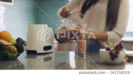 Smoothie, kitchen and hands with blender, wellness and breakfast in morning, detox and diet in house. Home, table and milkshake for person, healthy and nutrition for energy, drink and protein Smoothie, kitchen and hands with blender, wellness and breakfast in morning, detox and diet in house. Home, table and milkshake for person, healthy and nutrition for energy, drink and protein 142158329
