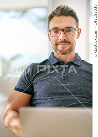 Smile, computer and portrait of man on sofa working on freelance creative project at apartment. Happy, glasses and mature male writer with laptop for research online with blog in living room at home. 142158339