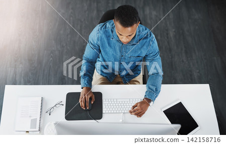Top view, business and black man with computer in office for project planning, online marketing or proposal at desk. Lens flare, employee and technology for reading email, report or graphic designer Top view, business and black man with computer in office for project planning, online marketing or proposal at desk. Lens flare, employee and technology for reading email, report or graphic designer 142158716
