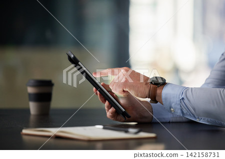 Businessman, tablet and hands in office typing for communication, corporate research and blog post. Male person, tech or notebook on desk working on online plan for website, social media or sales Businessman, tablet and hands in office typing for communication, corporate research and blog post. Male person, tech or notebook on desk working on online plan for website, social media or sales 142158731