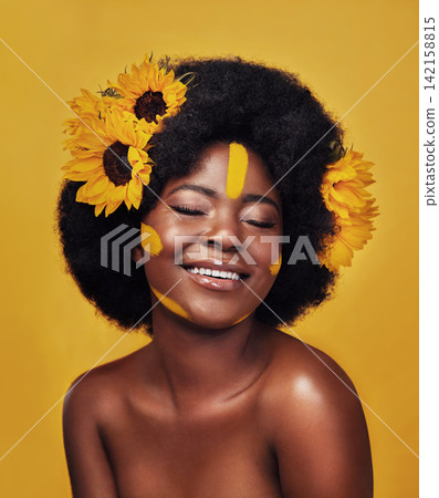 Black woman, happy and sunflower with skincare in studio for dermatology, natural glow or vitamin e. Person, floral and eyes closed with smile for organic, cosmetics or soft skin on yellow background Black woman, happy and sunflower with skincare in studio for dermatology, natural glow or vitamin e. Person, floral and eyes closed with smile for organic, cosmetics or soft skin on yellow background 142158815