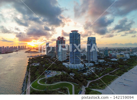 Aerial Miami south beach with sunset. Marina landscape in South Beach, USA. Skyline panorama. Sea beach. Miami South beach landscape aerial view. Skyline aerial on Miami marina, Florida Aerial Miami south beach with sunset. Marina landscape in South Beach, USA. Skyline panorama. Sea beach. Miami South beach landscape aerial view. Skyline aerial on Miami marina, Florida 142159094