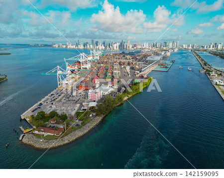 Miami, Florida, USA - June 07, 2024: Miami port aerial view. Panorama aerial drone view of Dodge island. Cargo Miami port with container. Port of Miami 142159095