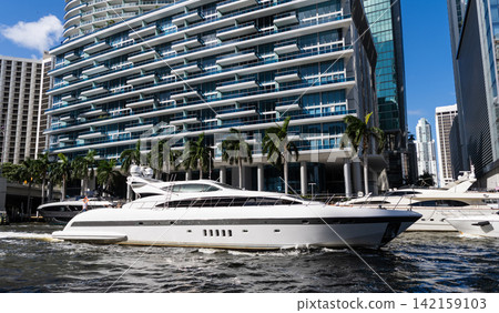 Luxury lifestyle. Vacation on summer. Yacht at sea. Sea vacation on summer. Luxury boat motor yacht in marina. Luxury yacht at Biscayne bay. Boating and yachting charter. Biscayne boulevard Luxury lifestyle. Vacation on summer. Yacht at sea. Sea vacation on summer. Luxury boat motor yacht in marina. Luxury yacht at Biscayne bay. Boating and yachting charter. Biscayne boulevard 142159103