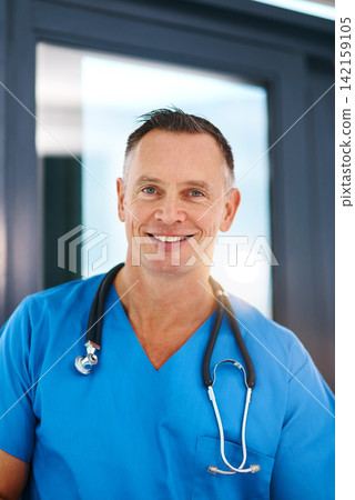 Smile, surgeon and portrait of mature man in a hospital at a cardiology clinic with confidence. Professional, medical employee and stethoscope with healthcare, wellness and cardiologist consultant Smile, surgeon and portrait of mature man in a hospital at a cardiology clinic with confidence. Professional, medical employee and stethoscope with healthcare, wellness and cardiologist consultant 142159105