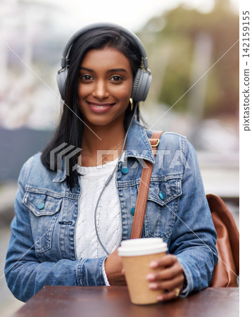 Portrait, headphones or Indian woman in cafe for college, knowledge or development for future growth. University, education or happy student with smile or coffee for studying or learning in city Portrait, headphones or Indian woman in cafe for college, knowledge or development for future growth. University, education or happy student with smile or coffee for studying or learning in city 142159155