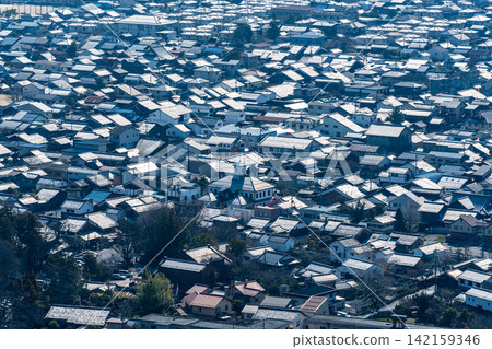 [Important Preservation District for Groups of Traditional Buildings] Hachiman - Springtime townscape viewed from Hachimanyama Castle 5, Omihachiman City, Shiga Prefecture 142159346