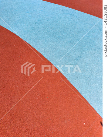 Colorful playground surface at a park during the day Colorful playground surface at a park during the day 142159392