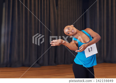 Woman, dancing and performing her routine in studio for auditions, art casting or creative school examination. Athletic, person and movement for balance, grace and physical activity or exercise Woman, dancing and performing her routine in studio for auditions, art casting or creative school examination. Athletic, person and movement for balance, grace and physical activity or exercise 142159849