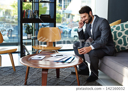 Happy, businessman and phone call with coffee in modern office for business discussion or chat. Young man, employee or financial advisor talking on mobile smartphone for conversation or online advice Happy, businessman and phone call with coffee in modern office for business discussion or chat. Young man, employee or financial advisor talking on mobile smartphone for conversation or online advice 142160032
