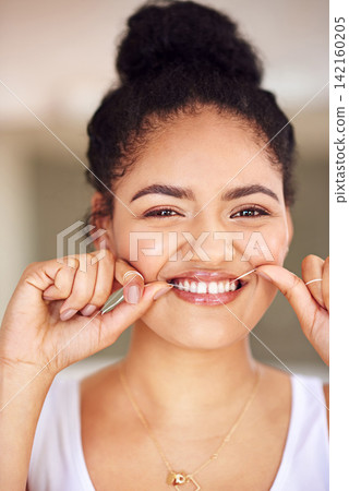 Smile, floss and portrait of woman with hygiene for morning teeth routine with health for gums. Happy, dentistry and female person with oral care thread for cleaning treatment to prevent cavity. Smile, floss and portrait of woman with hygiene for morning teeth routine with health for gums. Happy, dentistry and female person with oral care thread for cleaning treatment to prevent cavity. 142160205
