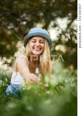 Girl, smile and outdoor, nature and flowers, park and grass lawn for plants, spring and garden. Field, happy and explore in countryside, meadow and botanical for summer, green and holiday or travel Girl, smile and outdoor, nature and flowers, park and grass lawn for plants, spring and garden. Field, happy and explore in countryside, meadow and botanical for summer, green and holiday or travel 142160367
