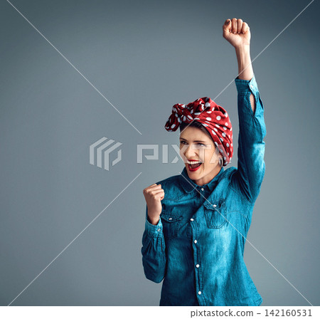 Woman, feminism and fist for community support, protest or celebration in grey studio background. Female person, smile and arm up in head scarf for revolution, power to the people or strong together Woman, feminism and fist for community support, protest or celebration in grey studio background. Female person, smile and arm up in head scarf for revolution, power to the people or strong together 142160531