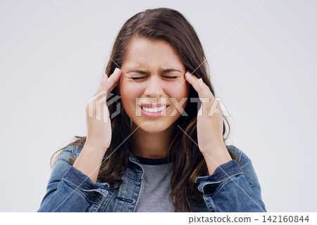 Woman, headache and pain in studio, stress and burnout or anxiety for mental health on gray background. Female person, worry and sad for fail or mistake, migraine and distress on mockup space or ill Woman, headache and pain in studio, stress and burnout or anxiety for mental health on gray background. Female person, worry and sad for fail or mistake, migraine and distress on mockup space or ill 142160844