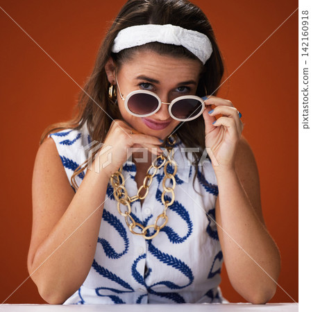 Portrait, confidence and woman with sunglasses for fashion in studio isolated on red background. Face, style and happy model with shades in casual clothes, cool and trendy on backdrop in Switzerland Portrait, confidence and woman with sunglasses for fashion in studio isolated on red background. Face, style and happy model with shades in casual clothes, cool and trendy on backdrop in Switzerland 142160918