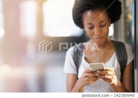 Phone, happy and black woman networking at university with mobile app, internet or website. Smile, technology and African female student typing and read email online with cellphone at college campus. Phone, happy and black woman networking at university with mobile app, internet or website. Smile, technology and African female student typing and read email online with cellphone at college campus. 142160940