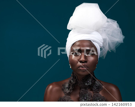 Beauty, fashion and portrait of black woman in turban and makeup in studio isolated on blue background mockup. African model, cosmetics and head scarf with serious face for traditional style in Kenya Beauty, fashion and portrait of black woman in turban and makeup in studio isolated on blue background mockup. African model, cosmetics and head scarf with serious face for traditional style in Kenya 142160953