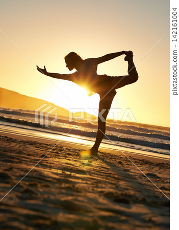 yoga, woman or balance on sunset beach for wellness, relax with zen for health mindset. Female instructor or sky with ocean for spiritual peace, lens flare and freedom on sand with faith for exercise yoga, woman or balance on sunset beach for wellness, relax with zen for health mindset. Female instructor or sky with ocean for spiritual peace, lens flare and freedom on sand with faith for exercise 142161004