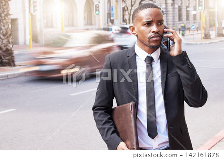 Serious, businessman and phone call for networking, conversation and communication on commute. Confident, black man and portfolio with smartphone for talking with lens flare outside on urban street Serious, businessman and phone call for networking, conversation and communication on commute. Confident, black man and portfolio with smartphone for talking with lens flare outside on urban street 142161878
