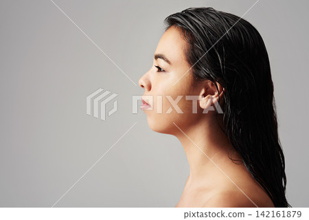 Woman, profile and haircare with salon cosmetics, skincare or beauty on a gray studio background. Young female person or model with wet hair or shower for spa, hygiene or keratin treatment on mockup Woman, profile and haircare with salon cosmetics, skincare or beauty on a gray studio background. Young female person or model with wet hair or shower for spa, hygiene or keratin treatment on mockup 142161879