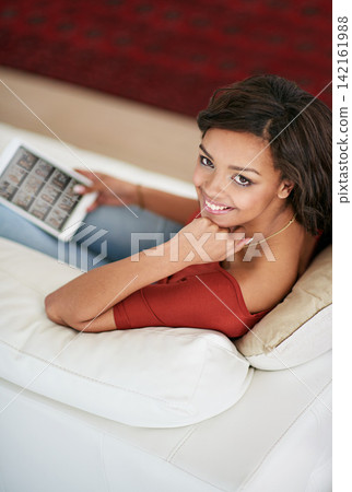 Girl, relax and portrait with tablet on sofa to watch video on holiday or streaming film on vacation. Online, search and woman scroll on website with tech in home to download movies or tv show Girl, relax and portrait with tablet on sofa to watch video on holiday or streaming film on vacation. Online, search and woman scroll on website with tech in home to download movies or tv show 142161988