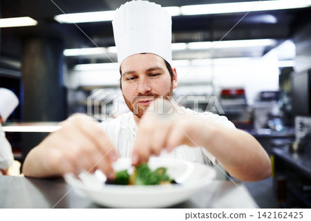 Salad, chef or hands of man in kitchen for lunch, fine dining or dinner presentation in restaurant. Business, cafe or male expert for catering, serving or recipe for culinary cuisine, dish or food Salad, chef or hands of man in kitchen for lunch, fine dining or dinner presentation in restaurant. Business, cafe or male expert for catering, serving or recipe for culinary cuisine, dish or food 142162425