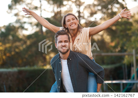 Man, woman and portrait with piggyback outdoor for relationship connection, anniversary or celebration. Happy couple, face and romance date in garden with airplane game for fun, playing or bonding Man, woman and portrait with piggyback outdoor for relationship connection, anniversary or celebration. Happy couple, face and romance date in garden with airplane game for fun, playing or bonding 142162767
