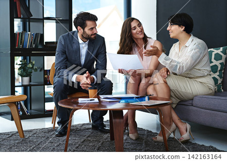 Business people, collaboration and meeting with documents for project discussion, brainstorming or planning at office. Young group of happy employees with paperwork for report or review at workplace Business people, collaboration and meeting with documents for project discussion, brainstorming or planning at office. Young group of happy employees with paperwork for report or review at workplace 142163164